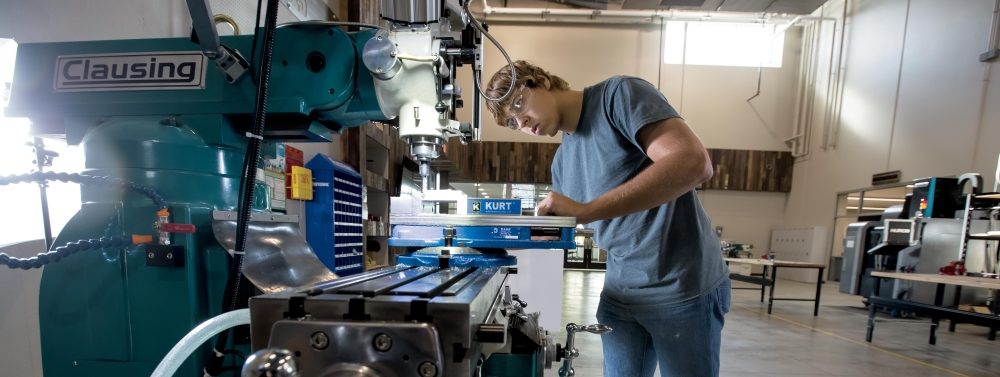 Student working with machinery at Purdue Polytechnic Institute